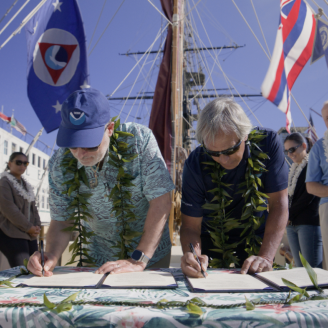 NOAA Administrator Rick Spinrad, Ph.D., and Polynesian Voyaging Society CEO Nainoa Thompson signed the MOU in San Diego, California, aboard Hōkūle‘a. (Image credit: Ryan Miyamoto)